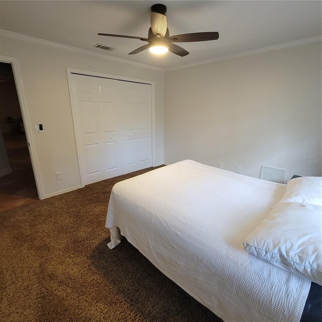 213 Sheffield Cir E, Palm Harbor, FL 34683 - bedroom with crown molding, carpet floors, a closet, and ceiling fan