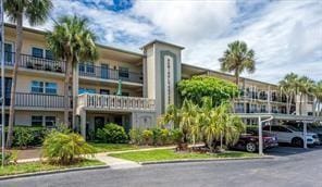 11720 Park Blvd Unit 301, Seminole, FL 33772 - view of building exterior with covered parking