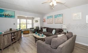 11720 Park Blvd Unit 301, Seminole, FL 33772 - living area with wood finished floors and ceiling fan