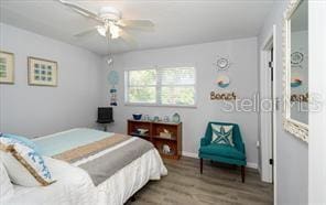 11720 Park Blvd Unit 301, Seminole, FL 33772 - bedroom with wood finished floors and a ceiling fan