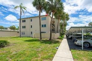 11720 Park Blvd Unit 301, Seminole, FL 33772 - view of building exterior with covered parking