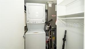11720 Park Blvd Unit 301, Seminole, FL 33772 - laundry room featuring stacked washer / dryer and laundry area