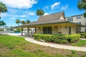 11720 Park Blvd Unit 301, Seminole, FL 33772 - rear view of house with a yard