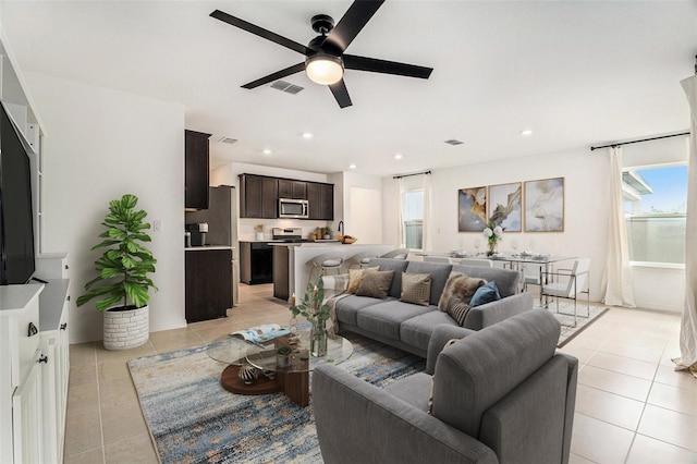 20659 Drake Elm Dr, Land O Lakes, FL 34638 - living area with light tile patterned floors, ceiling fan, and recessed lighting