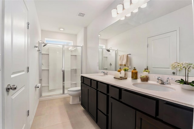 20659 Drake Elm Dr, Land O Lakes, FL 34638 - full bath featuring a stall shower, double vanity, toilet, and tile patterned flooring