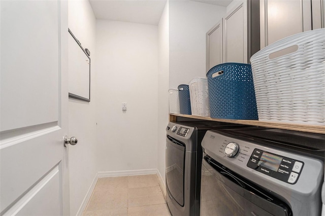 20659 Drake Elm Dr, Land O Lakes, FL 34638 - laundry area featuring baseboards, washing machine and clothes dryer, and light tile patterned floors