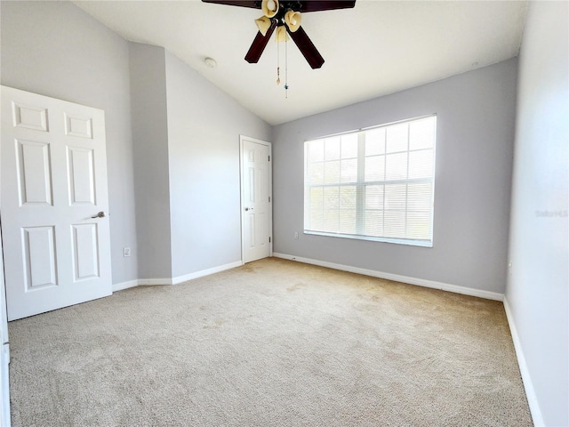 8796 Christie Dr, Largo, FL 33771 - unfurnished bedroom with carpet floors, baseboards, lofted ceiling, and a ceiling fan