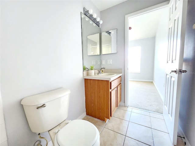 8796 Christie Dr, Largo, FL 33771 - bathroom with toilet, vanity, tile patterned floors, and baseboards