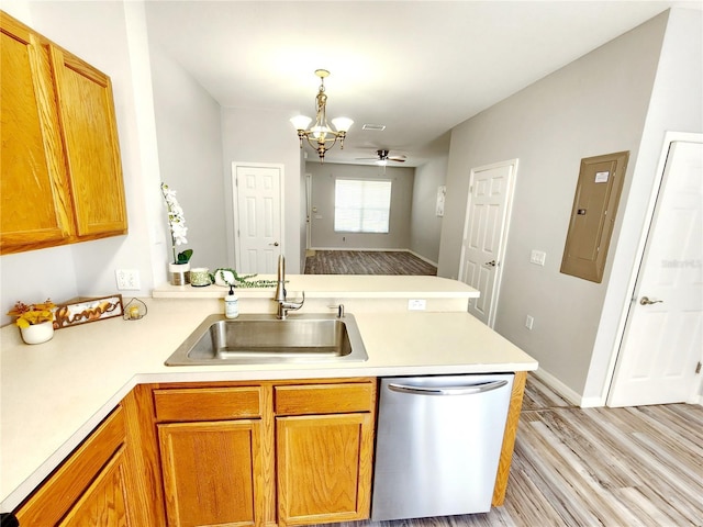 8796 Christie Dr, Largo, FL 33771 - kitchen with a sink, dishwasher, a peninsula, electric panel, and light countertops