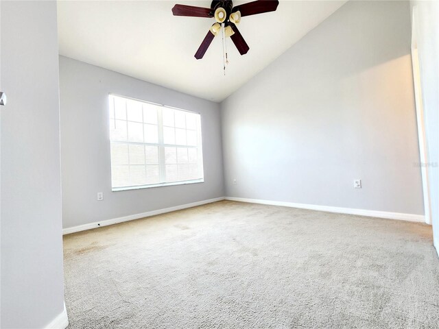 8796 Christie Dr, Largo, FL 33771 - carpeted spare room with lofted ceiling, baseboards, and ceiling fan