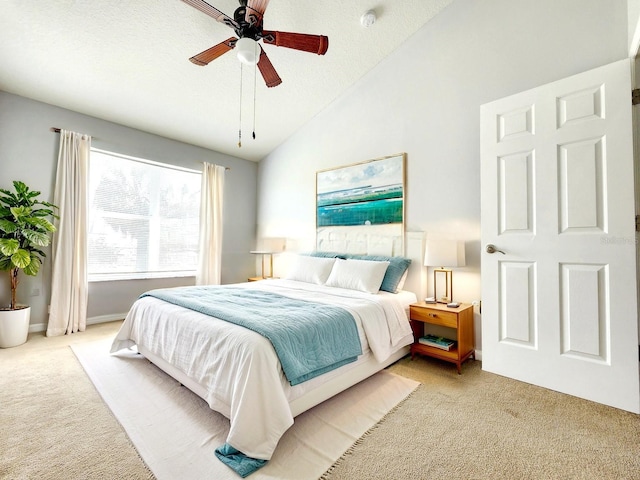 8796 Christie Dr, Largo, FL 33771 - bedroom featuring light carpet, ceiling fan, baseboards, and high vaulted ceiling