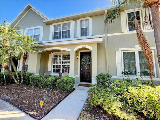 8796 Christie Dr, Largo, FL 33771 - view of front of home with stucco siding