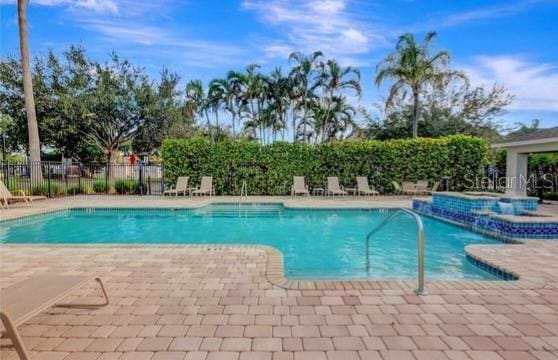 8796 Christie Dr, Largo, FL 33771 - community pool with a patio and a hot tub