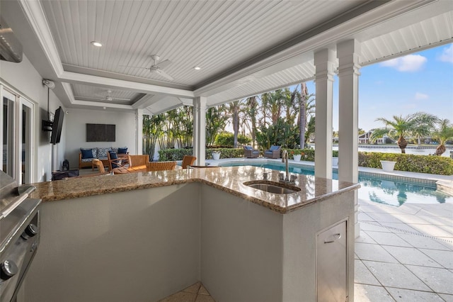 view of patio featuring an outdoor pool, a sink, an outdoor hangout area, and ceiling fan