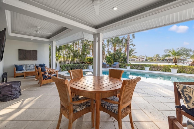view of patio / terrace featuring an outdoor living space, an outdoor pool, and ceiling fan