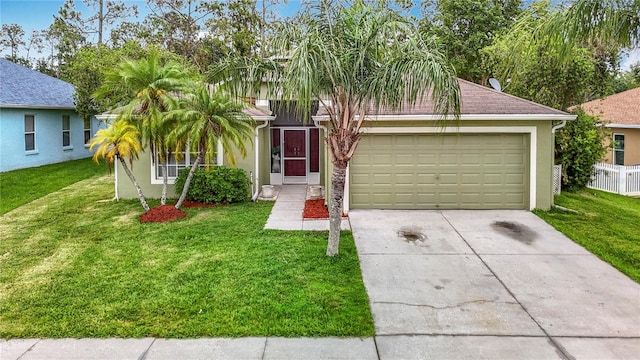 5526 Braddock Dr, Zephyrhills, FL 33541 - view of front of house featuring concrete driveway, a front lawn, a garage, and stucco siding