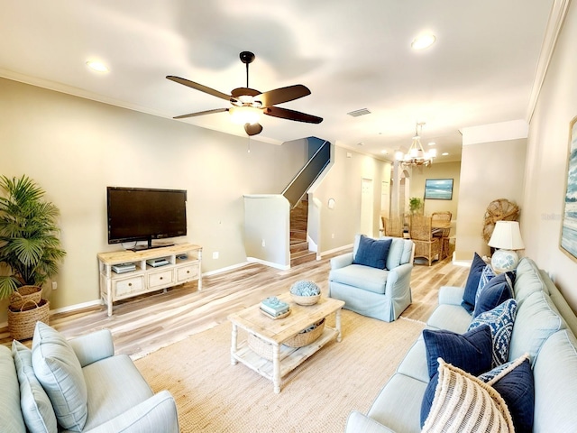 living room featuring recessed lighting, crown molding, stairs, and light wood-style flooring