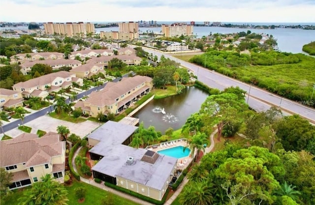 drone / aerial view with a city view and a water view