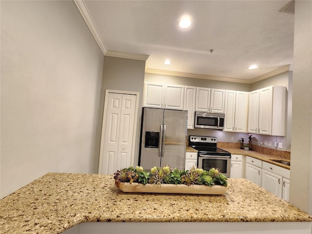 kitchen featuring crown molding, white cabinets, light stone counters, and stainless steel appliances
