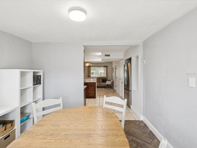232 Emerald Ln, Largo, FL 33771 - dining space featuring baseboards