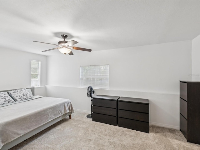 232 Emerald Ln, Largo, FL 33771 - carpeted bedroom featuring ceiling fan and baseboards