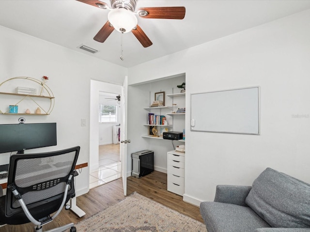 232 Emerald Ln, Largo, FL 33771 - office area featuring a ceiling fan and wood finished floors