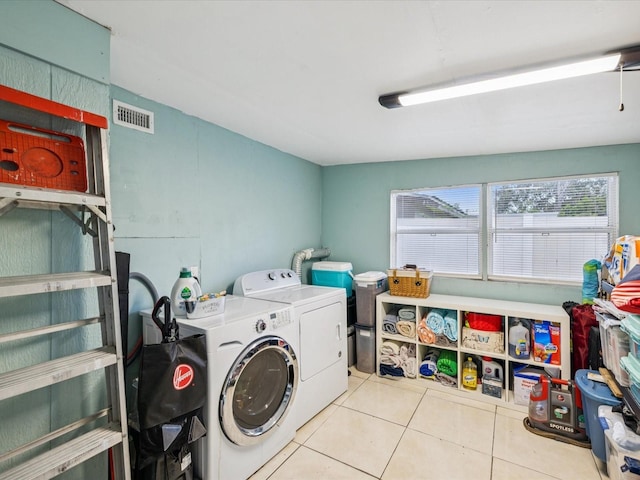 232 Emerald Ln, Largo, FL 33771 - laundry area with washer and dryer and tile patterned floors