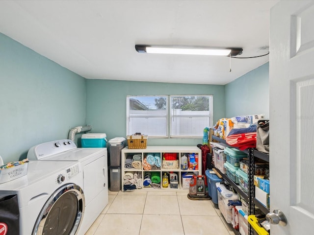 232 Emerald Ln, Largo, FL 33771 - washroom with washer and clothes dryer and tile patterned flooring
