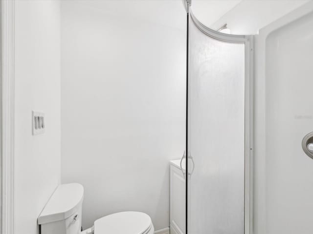 232 Emerald Ln, Largo, FL 33771 - bathroom with toilet and baseboards