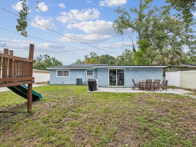 232 Emerald Ln, Largo, FL 33771 - rear view of property featuring stucco siding and a patio area