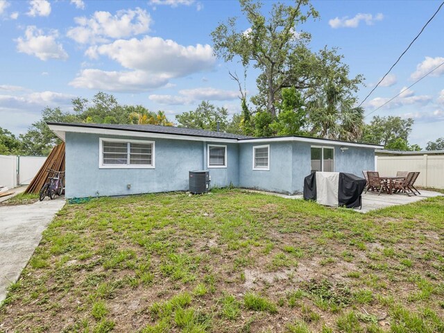 232 Emerald Ln, Largo, FL 33771 - rear view of house with stucco siding and a patio