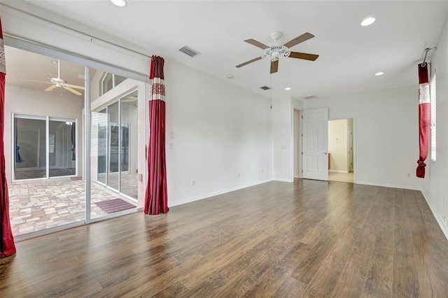 spare room featuring a healthy amount of sunlight, ceiling fan, visible vents, wood finished floors, and recessed lighting
