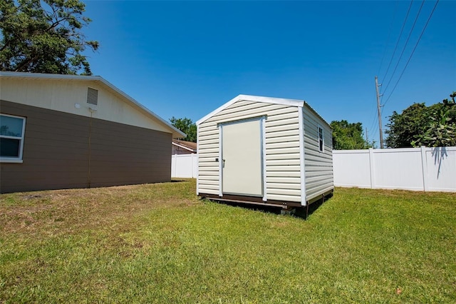 view of shed featuring a fenced backyard