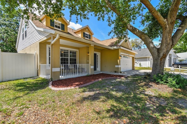 view of front of home featuring a garage, stucco siding, a porch, fence, and concrete driveway