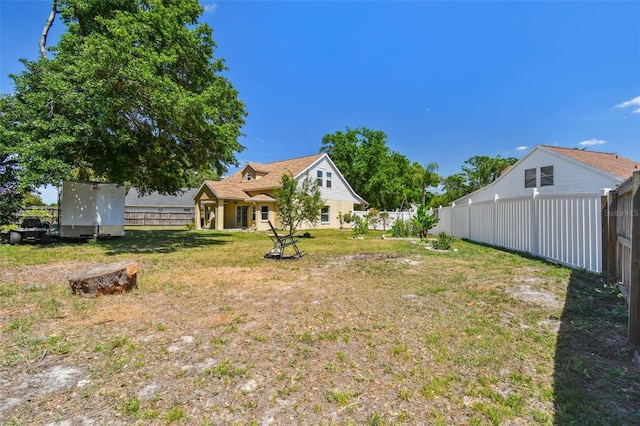 view of yard with a fenced backyard