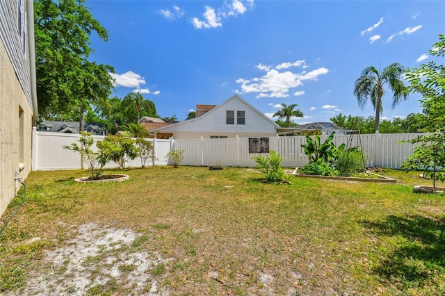 view of yard featuring a fenced backyard