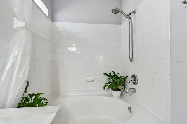 full bath featuring shower / bath combo with shower curtain