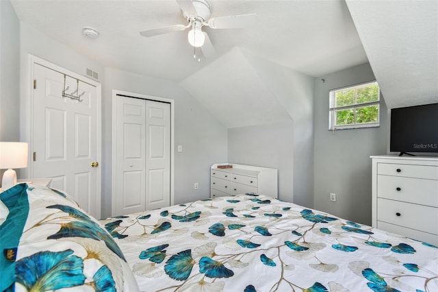 bedroom featuring visible vents, a closet, ceiling fan, and vaulted ceiling