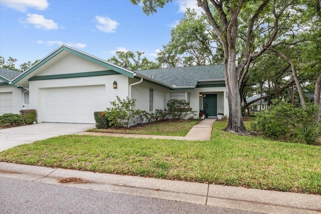 235 Woodridge Cir, Oldsmar, FL 34677 - single story home with stucco siding, roof with shingles, a front yard, an attached garage, and concrete driveway