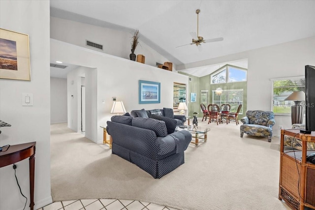 235 Woodridge Cir, Oldsmar, FL 34677 - living area with visible vents, high vaulted ceiling, a ceiling fan, and carpet flooring