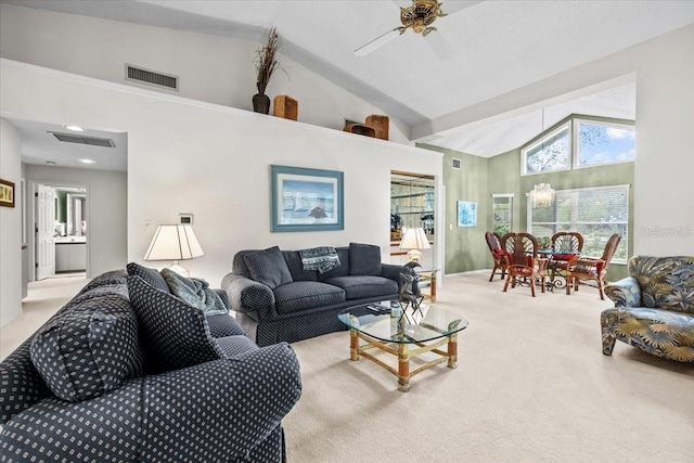235 Woodridge Cir, Oldsmar, FL 34677 - carpeted living area with high vaulted ceiling, visible vents, baseboards, and a ceiling fan