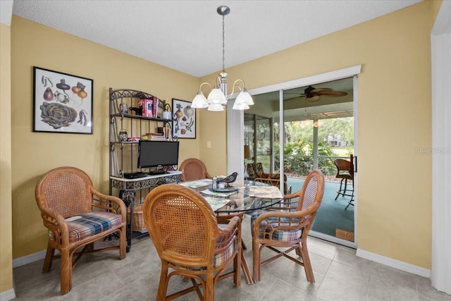 235 Woodridge Cir, Oldsmar, FL 34677 - dining room featuring light tile patterned floors, baseboards, and ceiling fan with notable chandelier