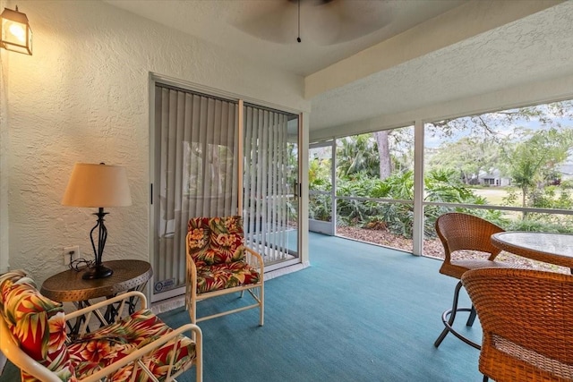 235 Woodridge Cir, Oldsmar, FL 34677 - sunroom / solarium with a textured wall, carpet flooring, and ceiling fan