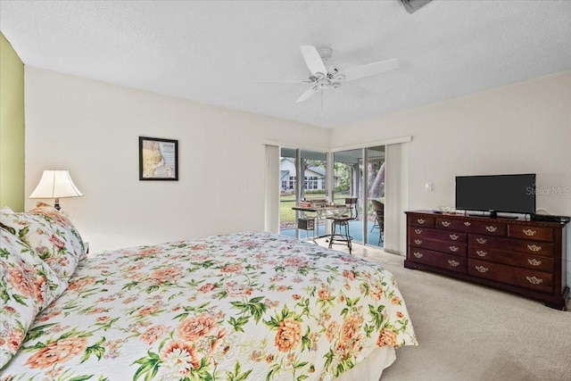 235 Woodridge Cir, Oldsmar, FL 34677 - bedroom with a ceiling fan, access to outside, light carpet, and a textured ceiling