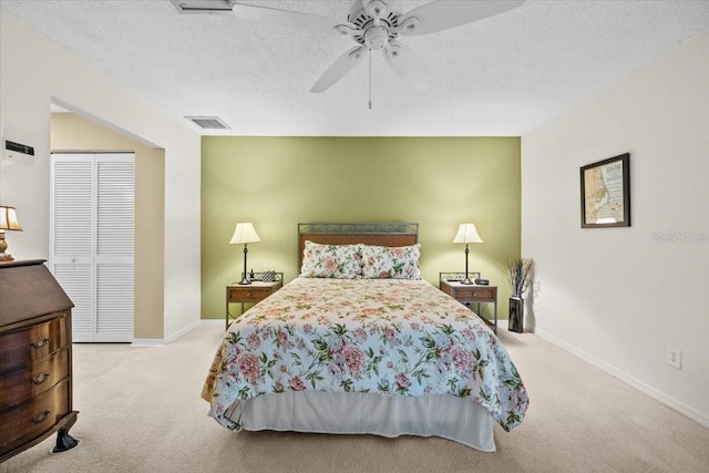 235 Woodridge Cir, Oldsmar, FL 34677 - bedroom featuring a textured ceiling, a closet, carpet, and visible vents