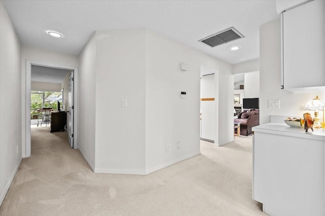 235 Woodridge Cir, Oldsmar, FL 34677 - hall with light carpet, baseboards, visible vents, and recessed lighting