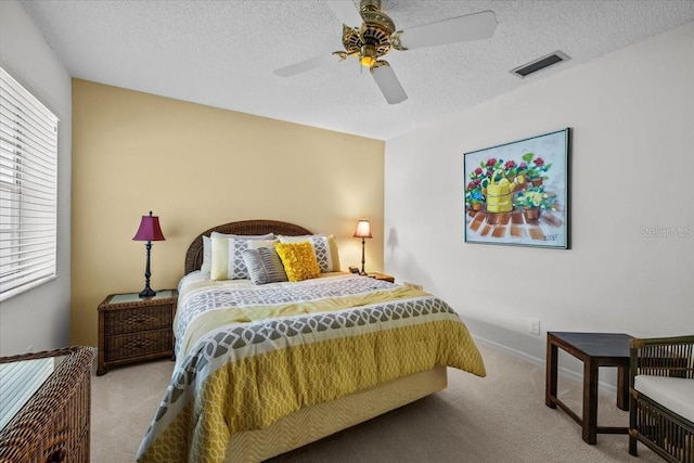 235 Woodridge Cir, Oldsmar, FL 34677 - carpeted bedroom featuring baseboards, visible vents, a textured ceiling, and a ceiling fan