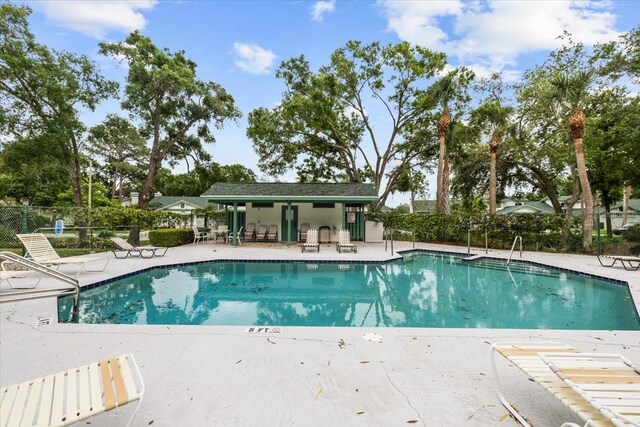 235 Woodridge Cir, Oldsmar, FL 34677 - pool with a patio and fence