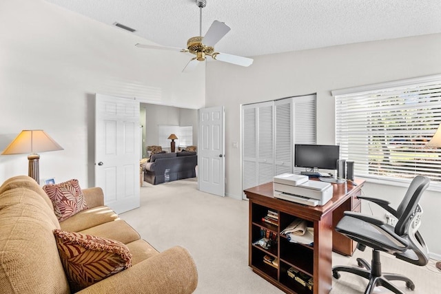 235 Woodridge Cir, Oldsmar, FL 34677 - home office featuring visible vents, a ceiling fan, a textured ceiling, vaulted ceiling, and light colored carpet