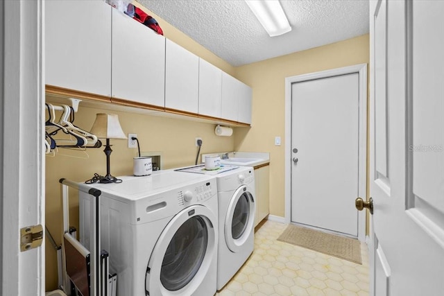 235 Woodridge Cir, Oldsmar, FL 34677 - laundry room with a textured ceiling, washing machine and clothes dryer, a sink, and cabinet space